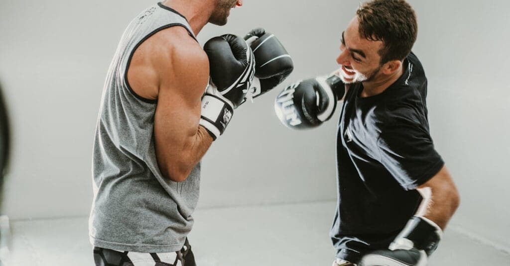 Training partners throw light punches during first Muay Thai class