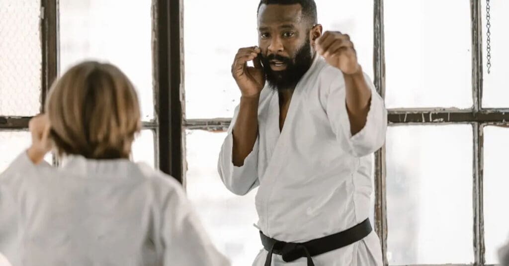 Instructor demonstrating guard position for first martial arts class tips