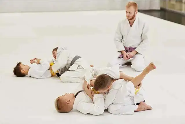 group of kids practicing for a kids martial arts class